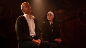 Joseph and Mary sit.